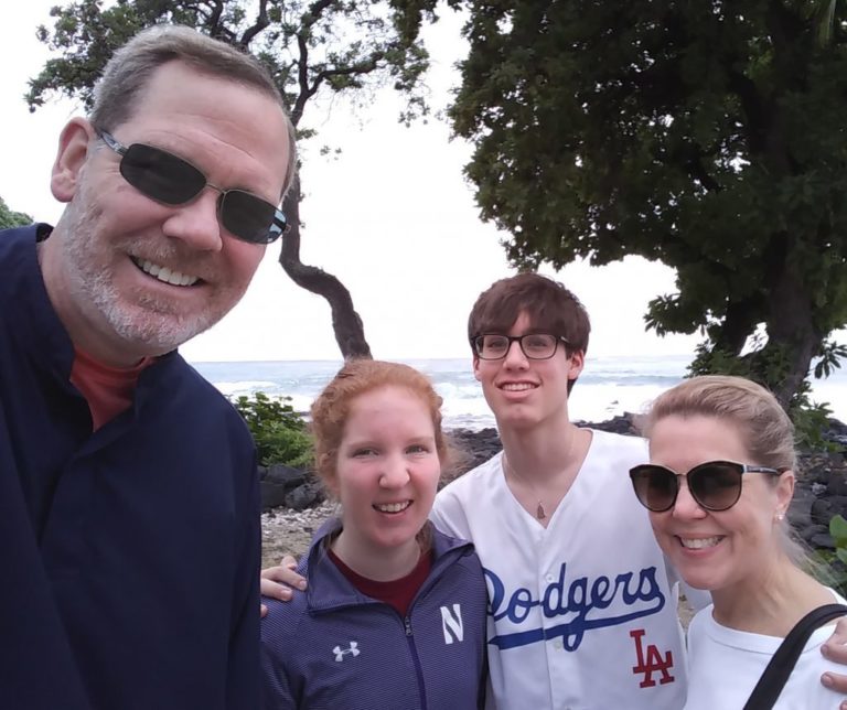 Executive Director John Peterson and his wife and two children