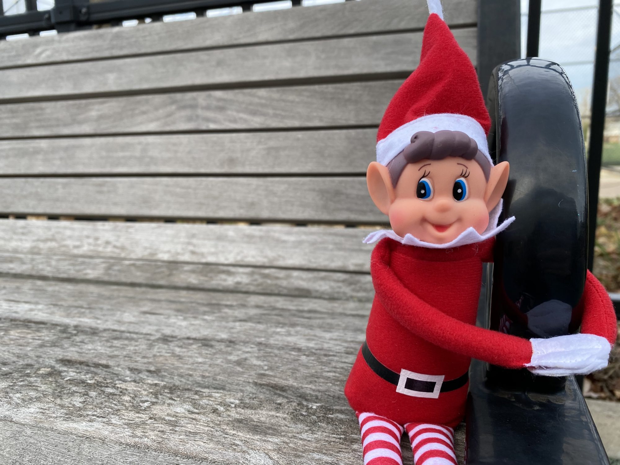 toy elf sitting on a bench