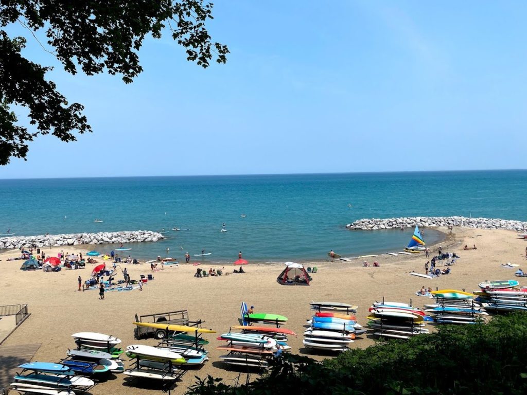 boat storage racks and beach goers at Lloyd Beach