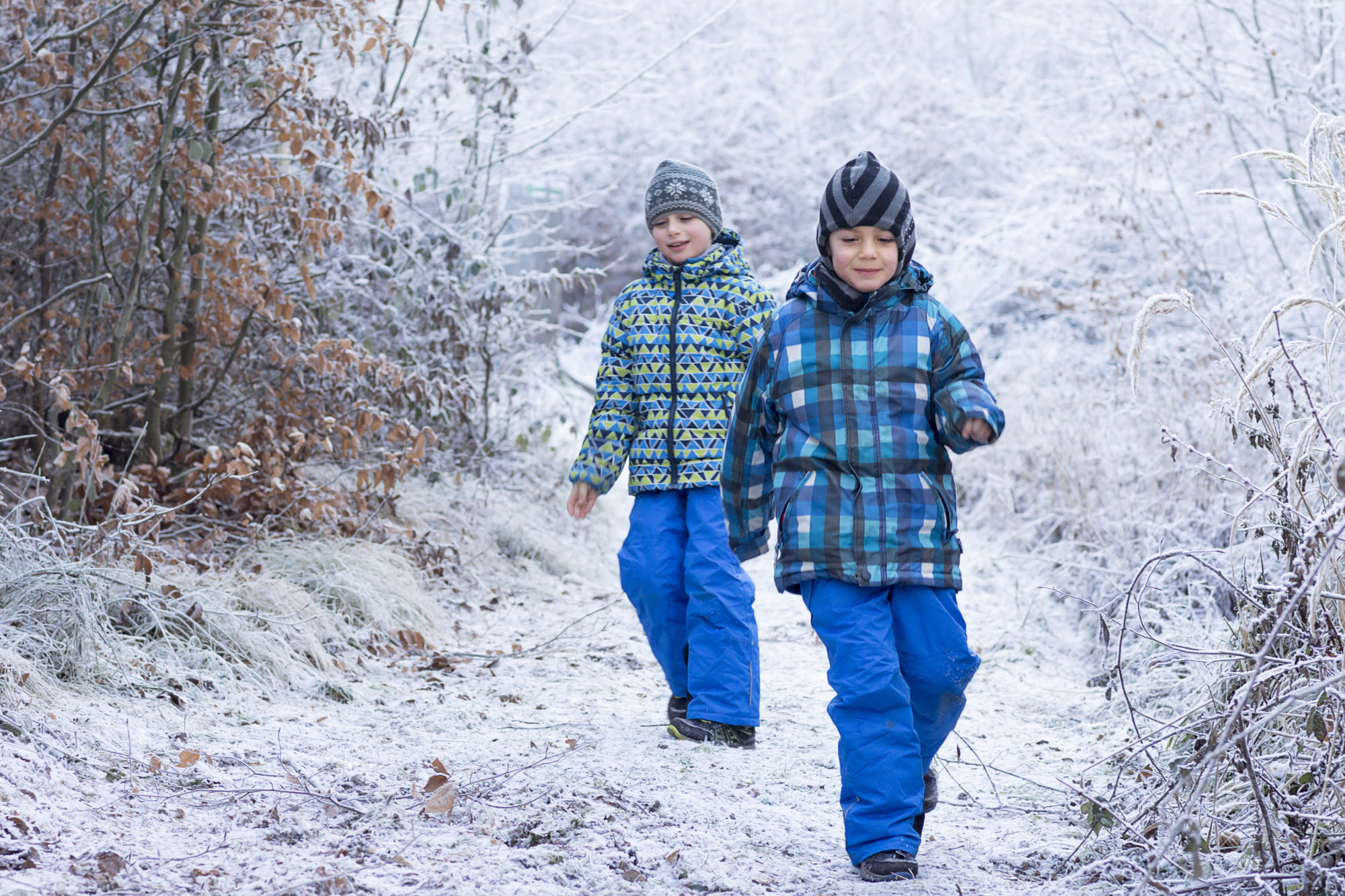 children hiking in snow