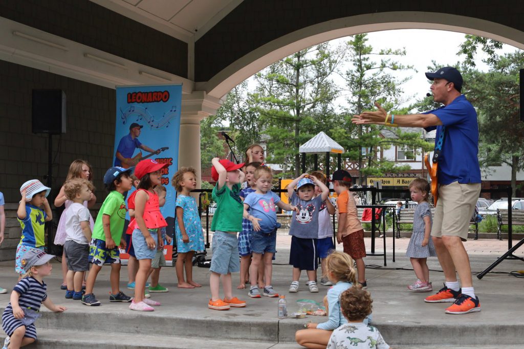 Group of children at a sing-a-long concert.
