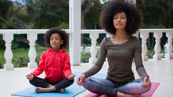 mom and daughter in meditation